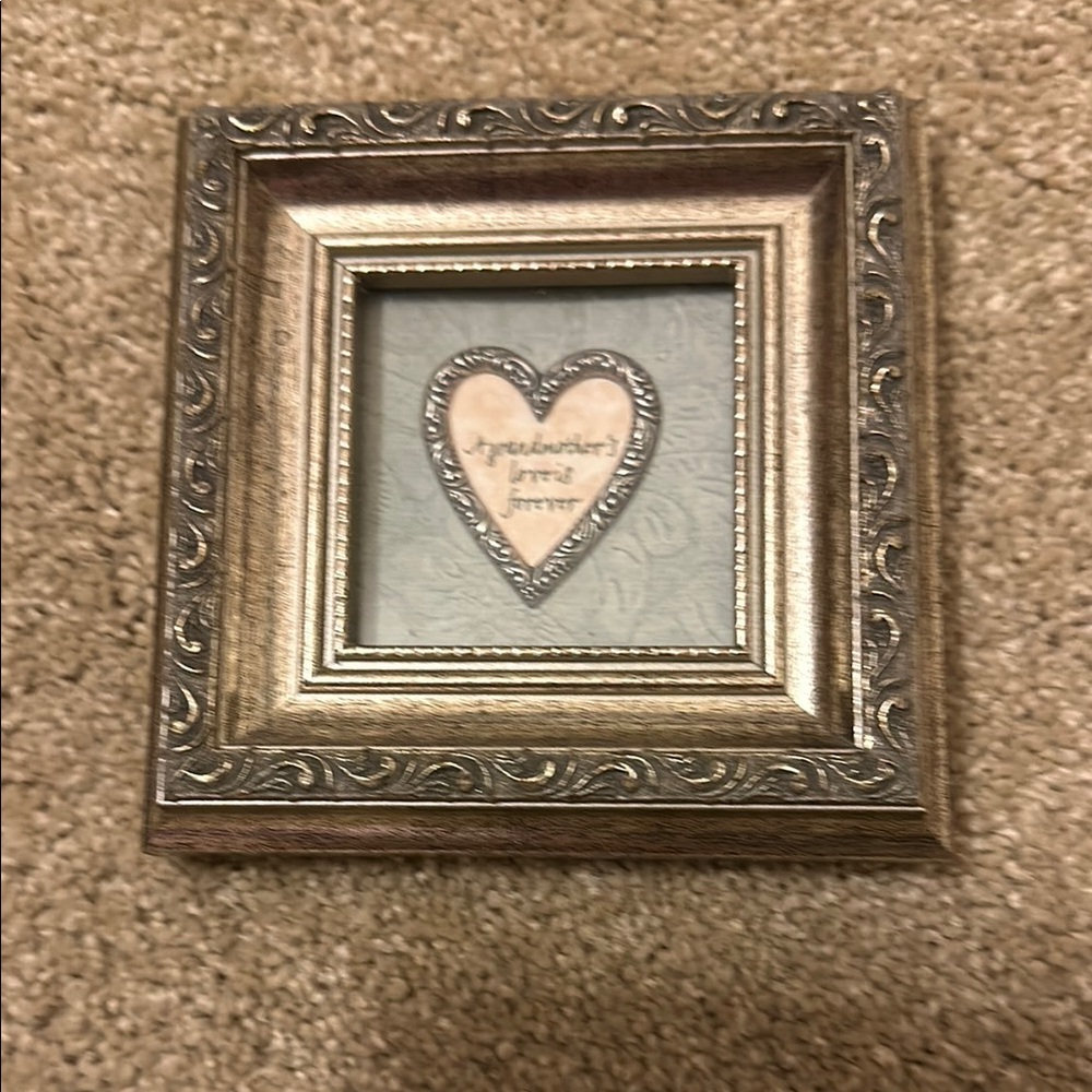 A grandmother’s love is forever silver leaf frame.  Excellent condition.